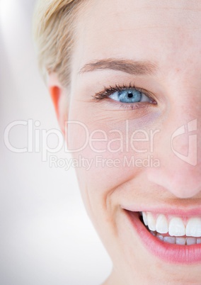 Close up of half woman's face against white background