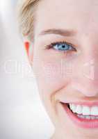 Close up of half woman's face against white background