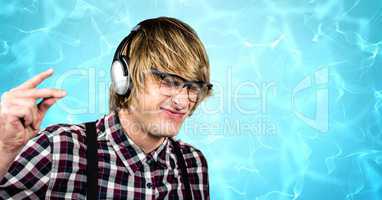 Male hipster snapping fingers while enjoying music on headphones