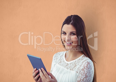 Happy young woman holding digital tablet