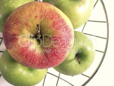 apples on a metallic basket