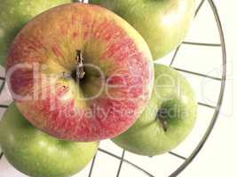 apples on a metallic basket