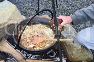Preparing wild mushrooms and venison goulash