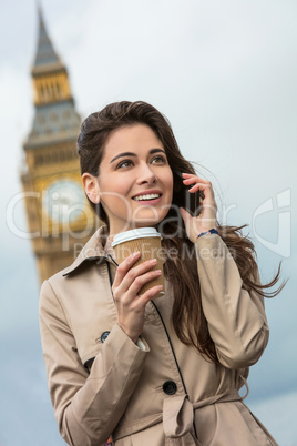Woman Drinking Coffee Using Cell Phone, Big Ben, London, England