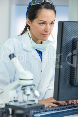 Female Scientist or Doctor Using Computer In Laboratory