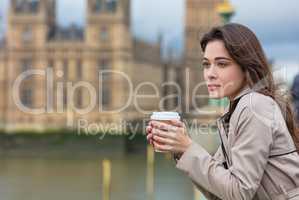 Sad Thoughtful Woman Drinking Coffee in London by Big Ben