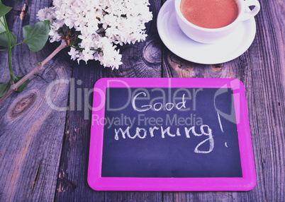 Black board with an inscription of white chalk good morning