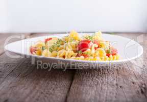Fussili pasta with watercress and cherry tomatoes.