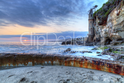 Sunset over Pirates tower at Victoria Beach in Laguna Beach