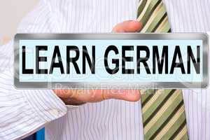 Man holds sign with inscription, Learn German
