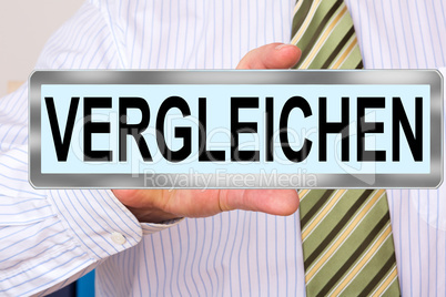 Man holds sign with inscription, VERGLEICHEN