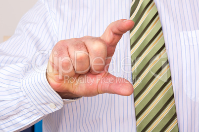 Man pointing finger size to