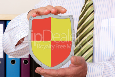 Businessman holding shield