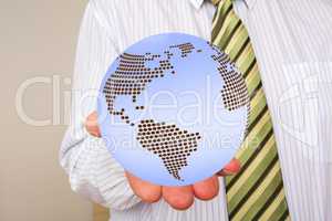 Businessman holding globe
