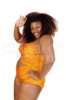 African woman in bikini waiving hand.