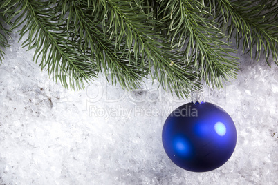 Christmas ball and spruce branch