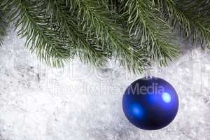 Christmas ball and spruce branch