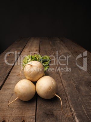 Three may turnip on wood