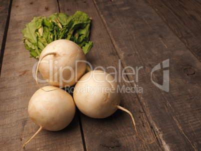 Three may turnip on wood