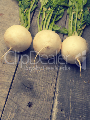 Three may turnip on wood