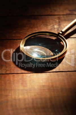 Magnifying Glass On Wood