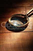 Magnifying Glass On Wood