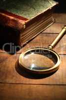 Magnifying Glass And Book