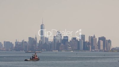 Tow ship sails on the Hudson River on Manhattan