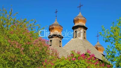 Wooden domes of Orthodox churches with crosses closeup