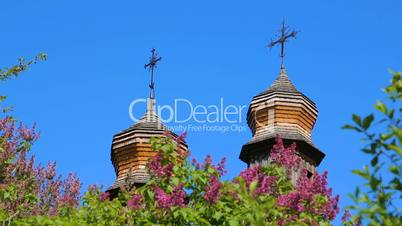 Wooden domes of Orthodox churches with crosses closeup