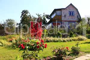 country house with green lawn