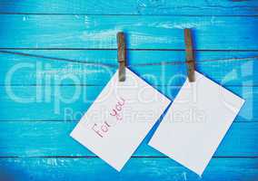 Two envelopes whistling on a rope