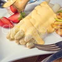 Asparagus , hollandaise sauce and baked potatoes