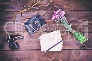 Blank greeting card and old vintage film camera
