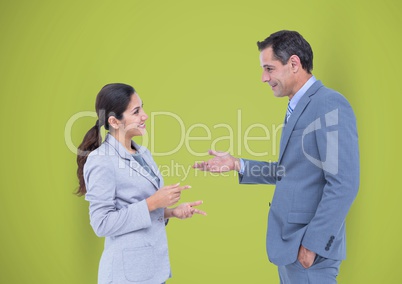 Business people talking against green background