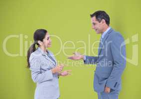 Business people talking against green background