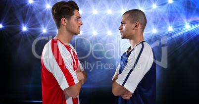Soccer players looking at each other at stadium