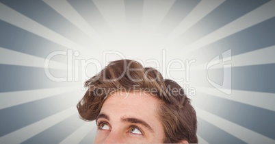 Male hipster looking up against illuminated background