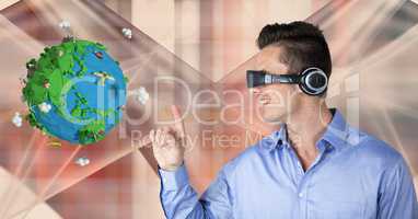 Businessman touching low poly globe while wearing VR headphones
