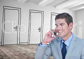 Smiling businessman using smart phone against drawn doors