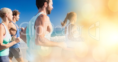 Friends jogging at beach