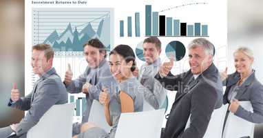 Business people showing thumbs up against graphs