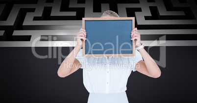 Businesswoman holding slate in front of face