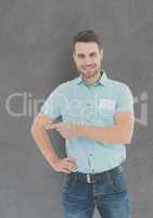Portrait of confident businessman gesturing against gray background