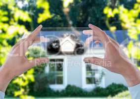 house with cloud on futuristic device in front of a house