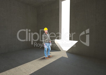 Male architect standing by arrow shape doorway