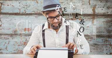 Male hipster using typewriter with alphabets flying up