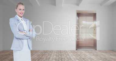 Confident businesswoman standing arms crossed in room