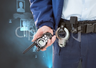 Midsection of security guard holding radio