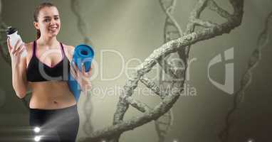 Woman holding yoga mat and bottle against DNA structures